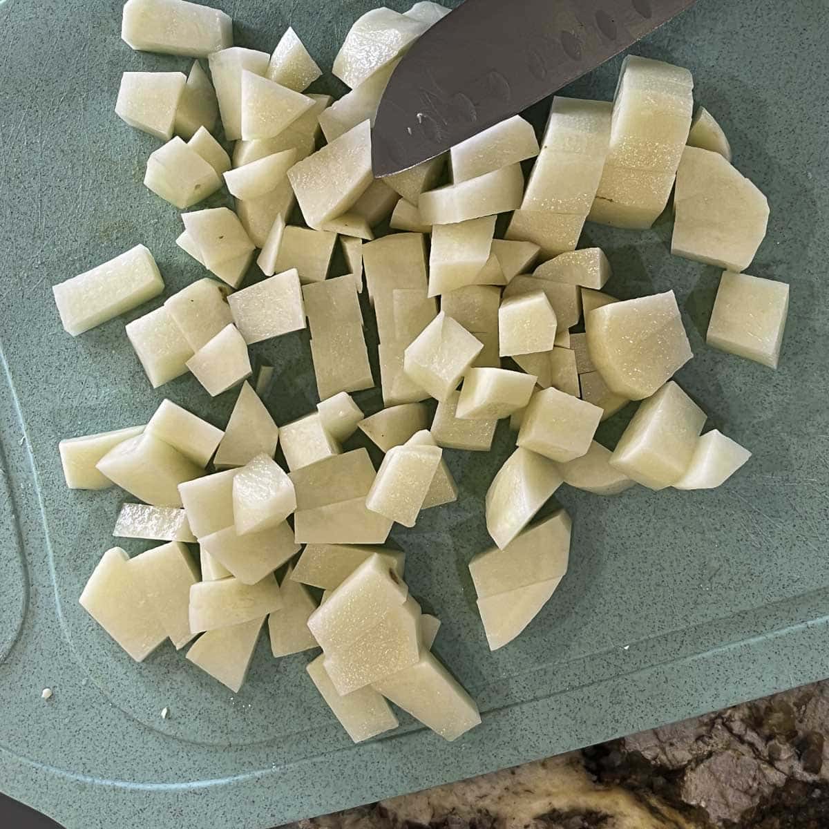 chopped potatoes on a cutting board