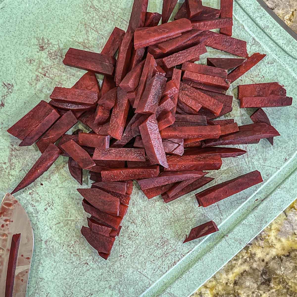 julienned beets on a cutting board